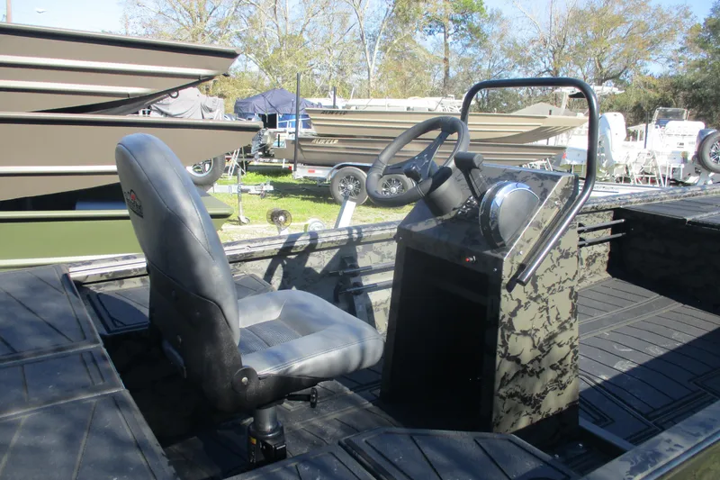 Slide: The Image of 2026 Gator Tail 1860 Extreme boat interior with steering console and seat. - 6