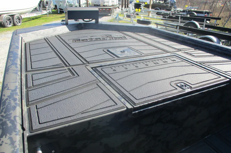 Slide: The Image of 2026 Gator Tail 1860 Extreme boat deck with textured surface and storage compartments. - 9