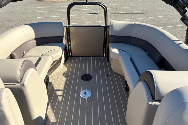 Slide: The Image of 2026 Bentley Pontoons Legacy 223 Navigator interior with beige seating and striped flooring. - 3