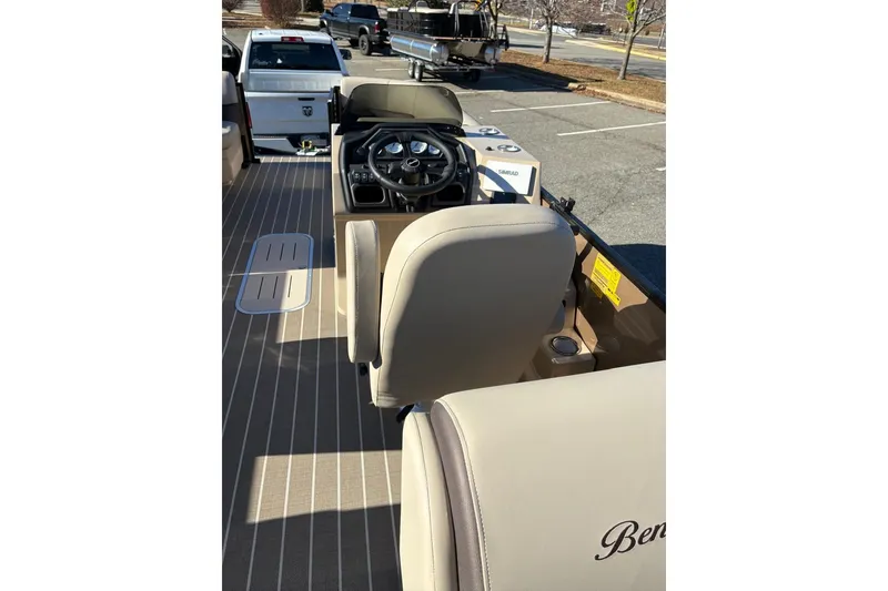 Slide: The Image of 2026 Bentley Pontoons Legacy 223 Navigator interior with steering wheel and seating. - 5