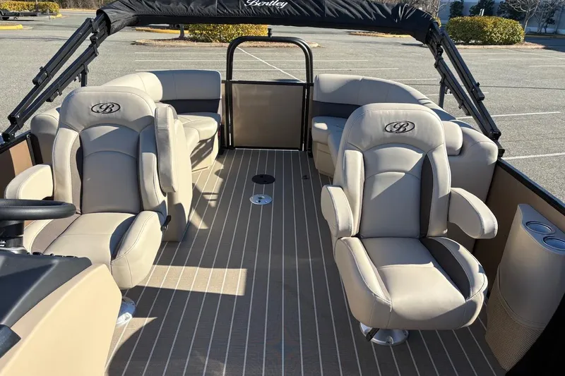 Slide: The Image of 2026 Bentley Pontoons Legacy 223 Navigator interior with luxurious seating and elegant design. - 6