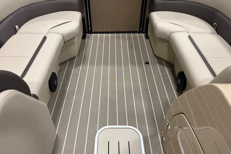 Slide: The Image of Interior of 2026 Bentley Pontoons Legacy 223 Navigator with beige seating and striped flooring. - 9