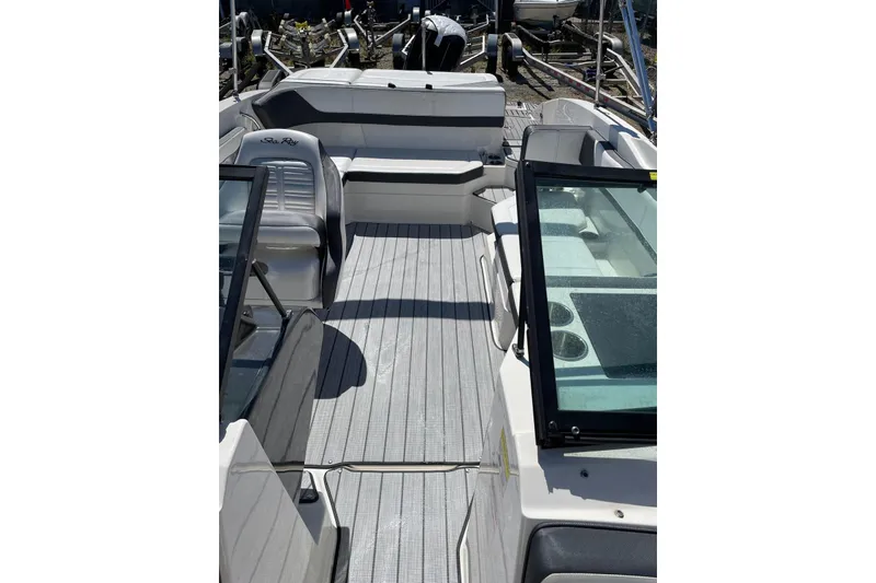 Slide: The Image of 2016 Sea Ray SPX 210 Outboard boat interior with seating and windshield. - 10