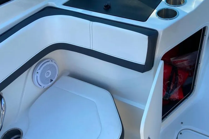 Slide: The Image of Interior of 2016 Sea Ray SPX 210 Outboard boat with seating and storage compartment. - 12