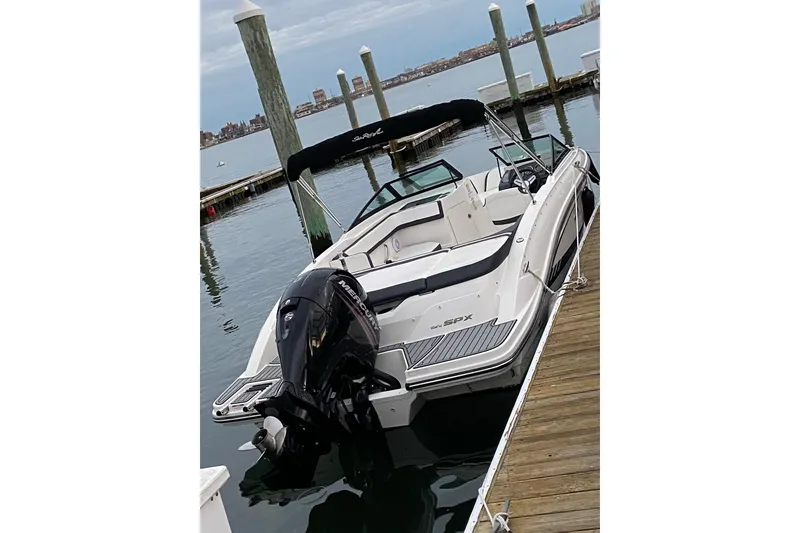 Slide: The Image of 2016 Sea Ray SPX 210 Outboard boat docked at marina. - 4