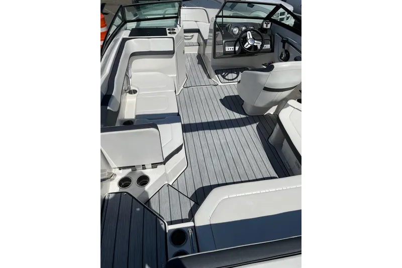 Slide: The Image of 2016 Sea Ray SPX 210 Outboard boat interior with sleek seating and modern dashboard. - 8