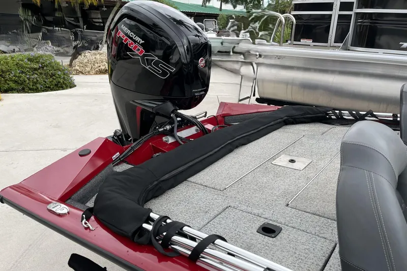 Slide: The Image of 2024 Tracker Pro Team 190 boat with Mercury Pro XS engine, red and gray interior. - 11
