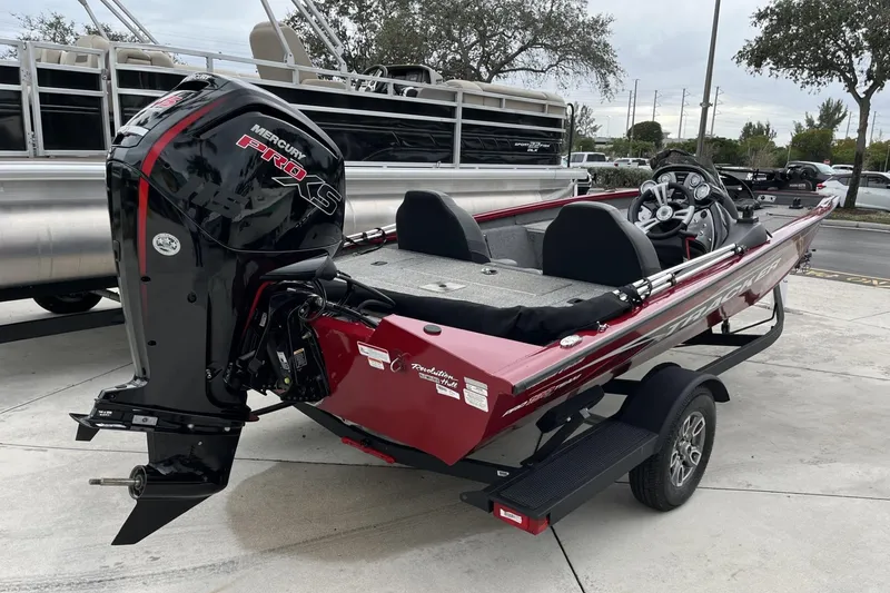 Slide: The Image of 2024 Tracker Pro Team 190 boat with Mercury Pro XS engine, parked on a trailer. - 4