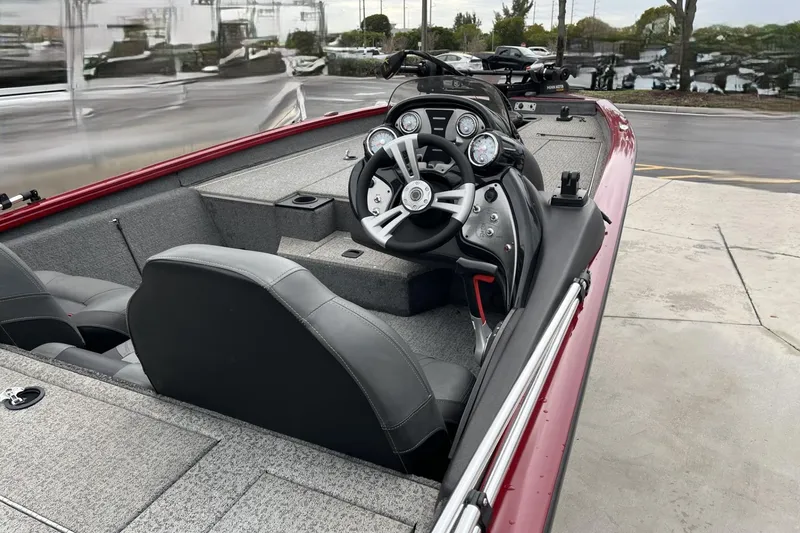 Slide: The Image of 2024 Tracker Pro Team 190 boat interior with steering wheel and dashboard. - 6