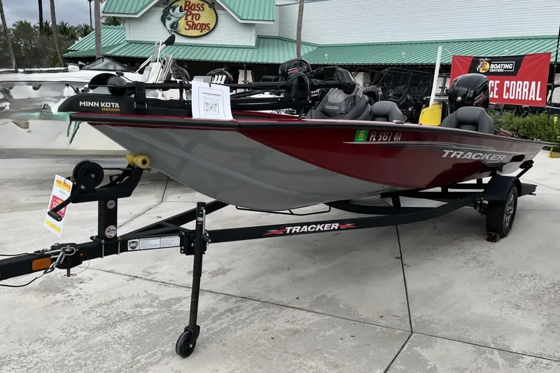 Slide: The Image of 2024 Tracker Pro Team 190 boat on trailer at Bass Pro Shops display. - 9