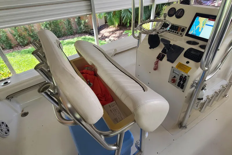 Slide: The Image of 2008 Key West 246 Bay Reef boat interior with steering console and seating. - 12