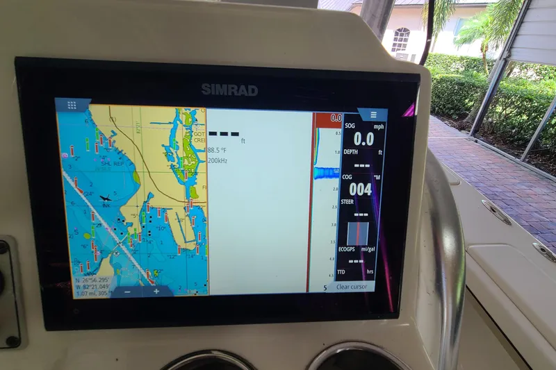Slide: The Image of Simrad navigation display on 2008 Key West 246 Bay Reef boat, showing nautical map and data. - 15