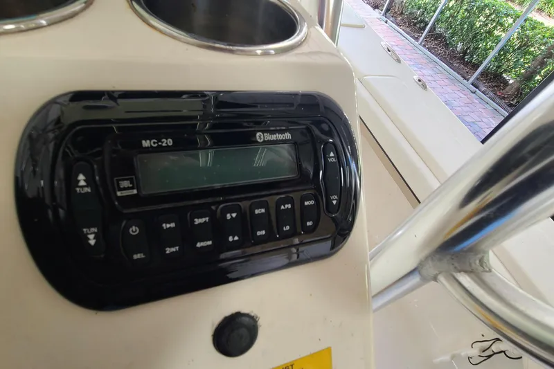 Slide: The Image of 2008 Key West 246 Bay Reef boat console with Bluetooth stereo system. - 16