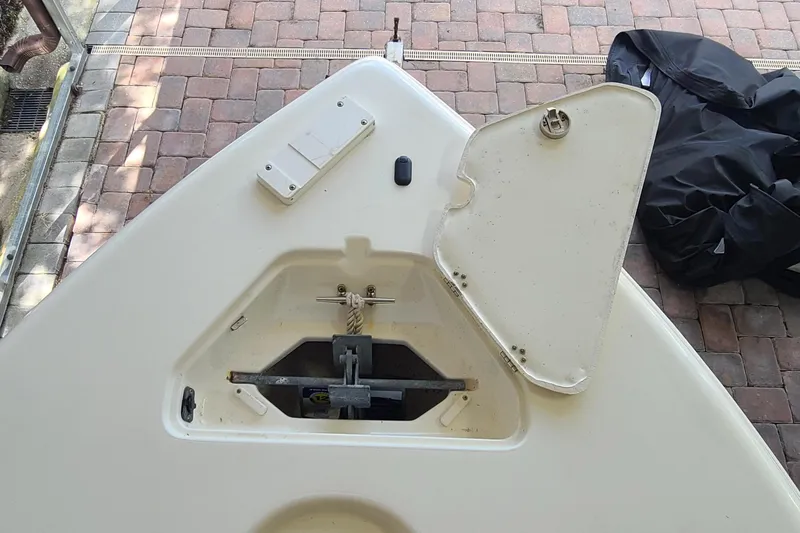 Slide: The Image of Key West 246 Bay Reef 2008 boat anchor compartment on brick pavement. - 3