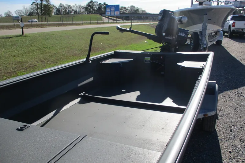 Slide: The Image of 2026 Gator Tail 1860 Extreme boat on trailer, parked near road. - 11