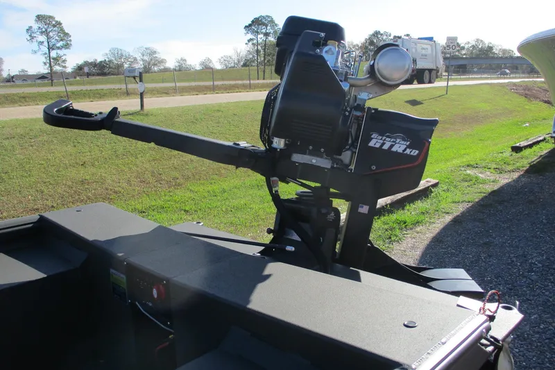 Slide: The Image of 2026 Gator Tail 1860 Extreme boat with powerful motor, parked on grassy area. - 12