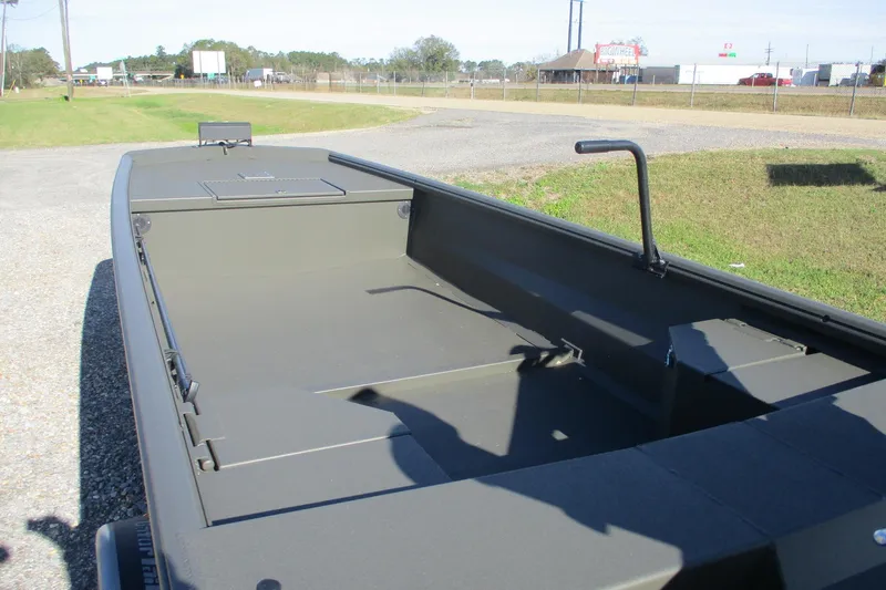 Slide: The Image of 2026 Gator Tail 1860 Extreme boat, open interior view, parked outdoors. - 9