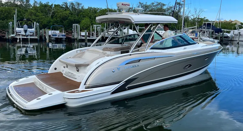 Slide: The Image of 2014 Formula 350 Crossover Bowrider in marina, sleek design, luxury features. - 6
