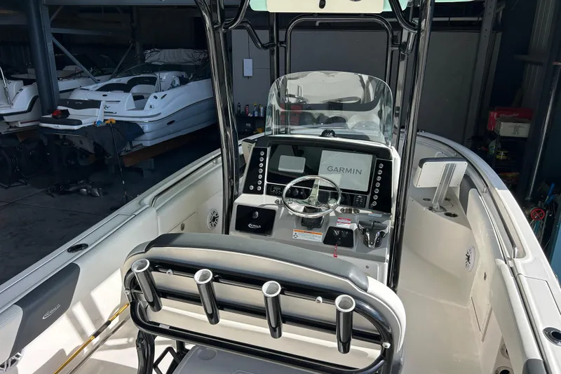 Slide: The Image of 2023 Robalo R242 Center Console boat interior with Garmin navigation system. - 10