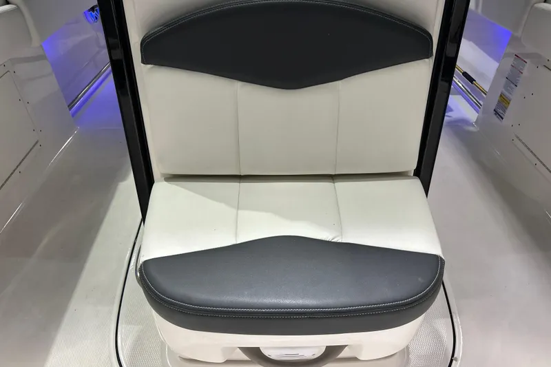 Slide: The Image of 2023 Robalo R242 Center Console boat seat, white and black upholstery. - 23