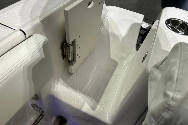 Slide: The Image of 2023 Robalo R242 Center Console boat interior with seating and cup holder. - 34