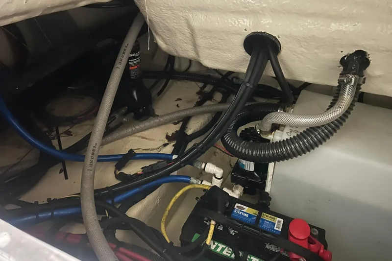 Slide: The Image of 2023 Robalo R242 Center Console boat interior wiring and battery setup. - 36