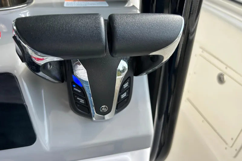 Slide: The Image of 2023 Robalo R242 Center Console boat in storage, side view. - 5