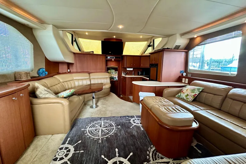 Slide: The Image of Luxurious interior of 2005 Silverton 43 Motor Yacht with plush seating and elegant decor. - 17