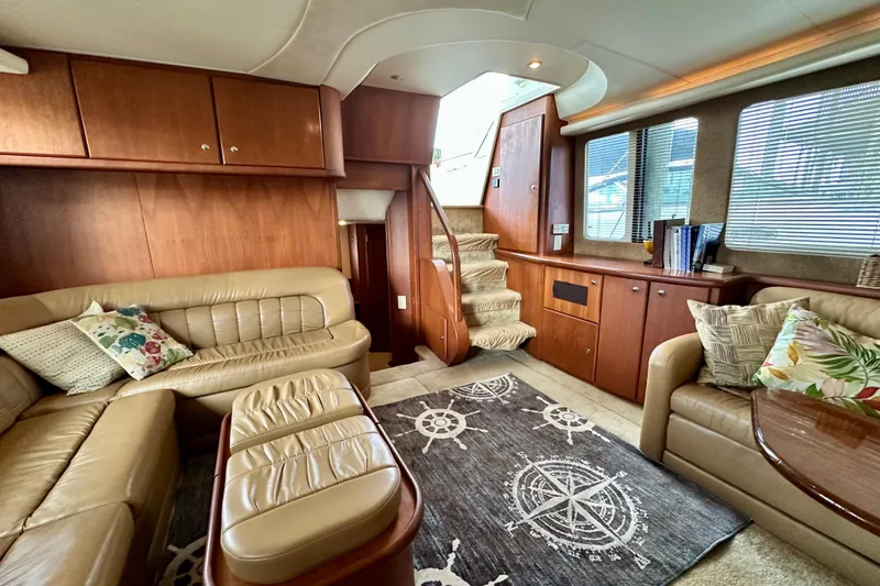 Slide: The Image of Luxurious interior of 2005 Silverton 43 Motor Yacht with plush seating and elegant wood finishes. - 18