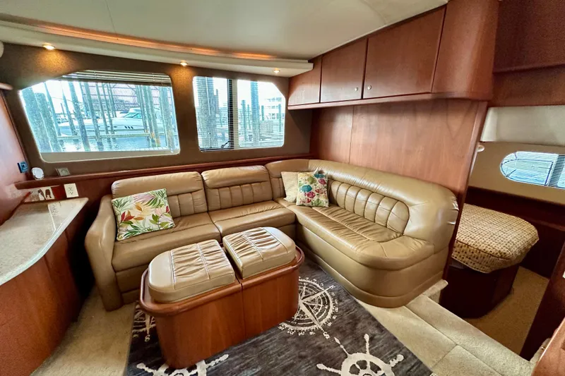 Slide: The Image of 2005 Silverton 43 Motor Yacht interior with leather seating and nautical decor. - 26
