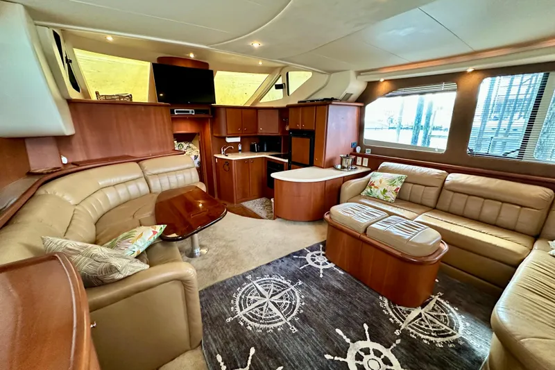 Slide: The Image of Luxurious interior of 2005 Silverton 43 Motor Yacht with plush seating and elegant decor. - 30