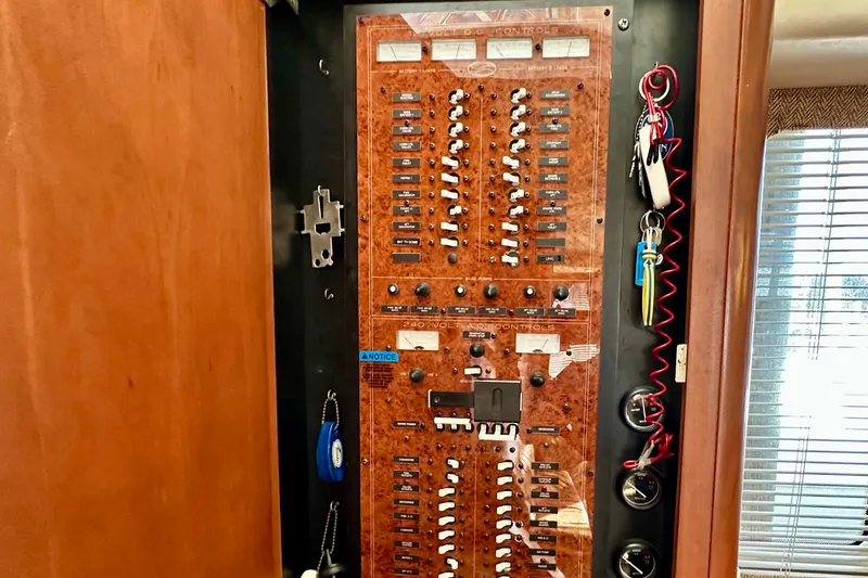 Slide: The Image of Electrical control panel on a 2005 Silverton 43 Motor Yacht, featuring switches and gauges. - 33