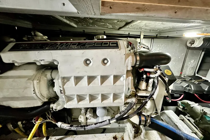 Slide: The Image of Engine room of a 2005 Silverton 43 Motor Yacht, showcasing high-performance machinery. - 35