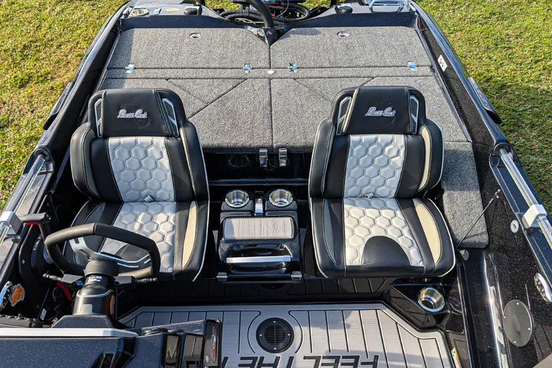 Slide: The Image of 2026 Bass Cat Eyra SP boat interior with dual seats and steering wheel. - 12