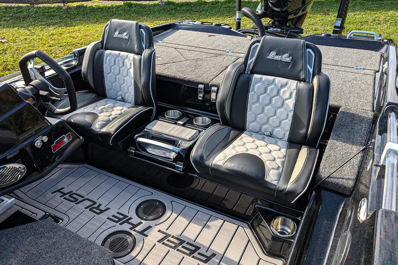Slide: The Image of 2026 Bass Cat Eyra SP boat interior with stylish seats and modern dashboard. - 13