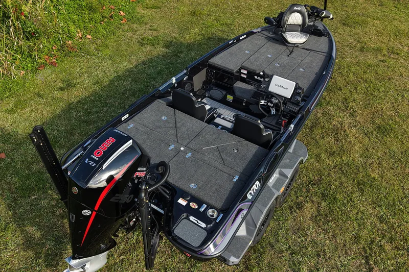 Slide: The Image of 2026 Bass Cat Eyra SP fishing boat on grass, featuring advanced equipment and sleek design. - 7