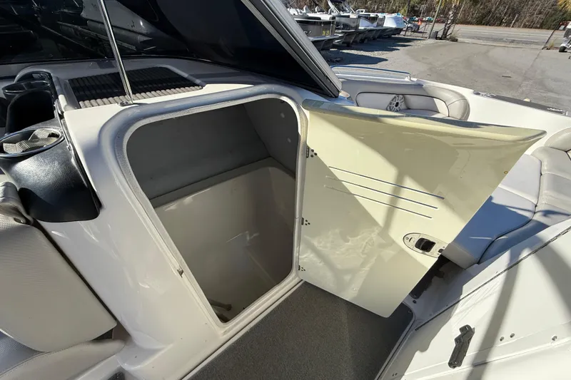 Slide: The Image of 2011 Yamaha Boats AR240 HO interior storage compartment with open door. - 16