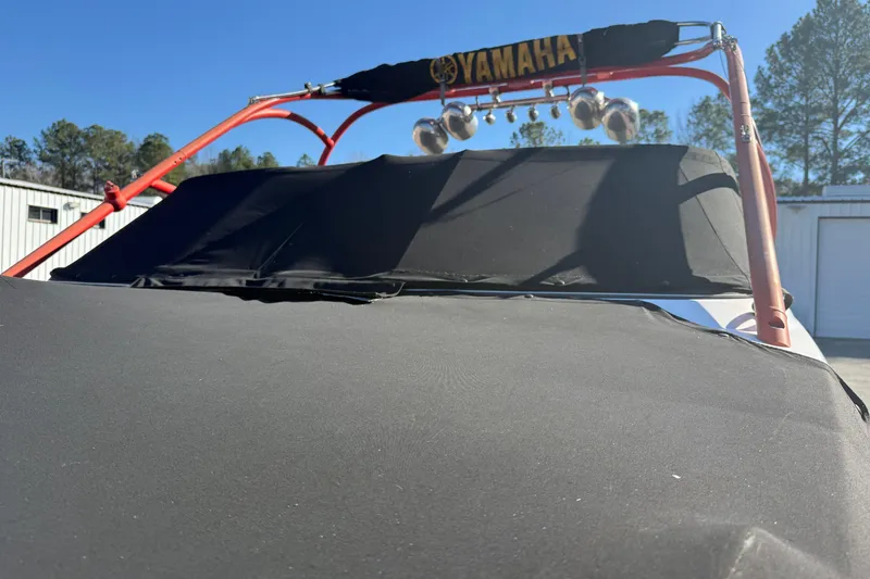 Slide: The Image of 2011 Yamaha Boats AR240 HO with cover and wakeboard tower in storage area. - 19