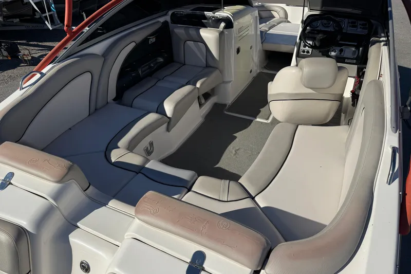 Slide: The Image of 2011 Yamaha Boats AR240 HO interior with spacious seating and modern dashboard. - 7