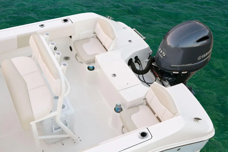 Slide: The Image of Manufacturer Provided Image: 2016 Robalo R180 Center Console boat with Yamaha outboard motor on clear water. - 11