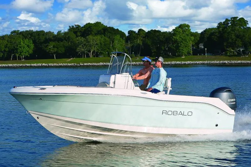 Slide: The Image of Manufacturer Provided Image: 2016 Robalo R180 Center Console boat cruising on a lake. - 8