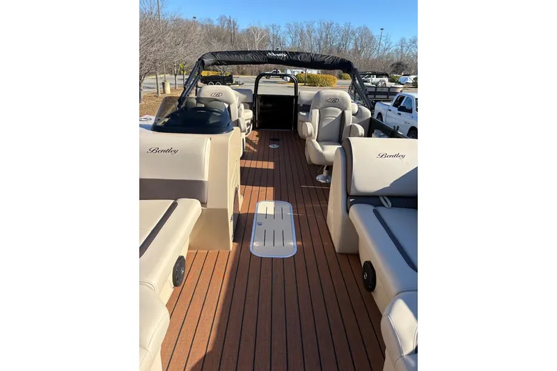 Slide: The Image of 2026 Bentley Pontoons Legacy 223 Navigator interior with luxurious seating and sleek design. - 2