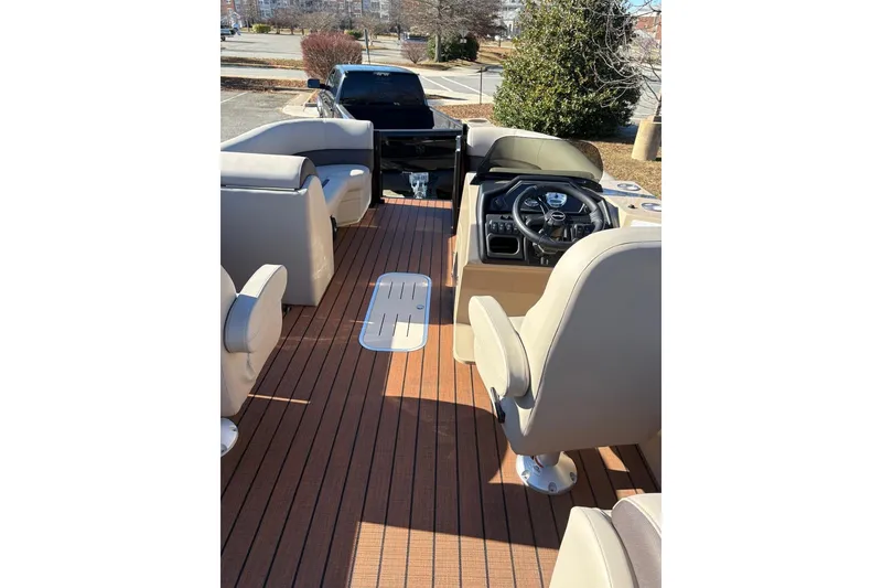 Slide: The Image of 2026 Bentley Pontoons Legacy 223 Navigator interior with luxurious seating and modern helm. - 8