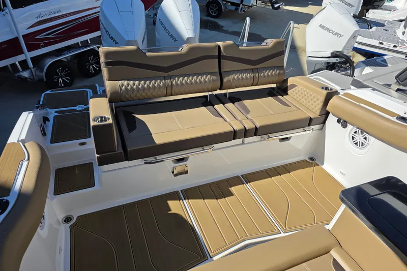 Slide: The Image of Luxurious seating area on 2026 Monterey Elite 30 OB boat with tan upholstery. - 14