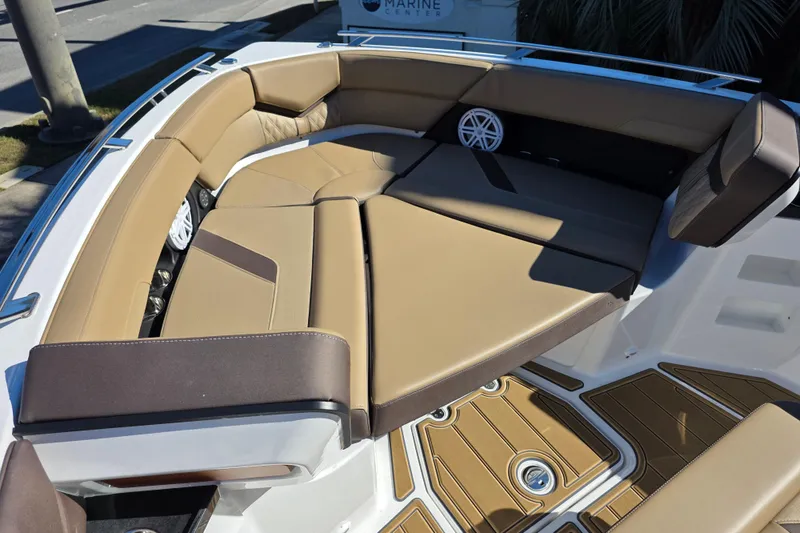 Slide: The Image of Luxurious seating area on 2026 Monterey Elite 30 OB boat with tan cushions and sleek design. - 18
