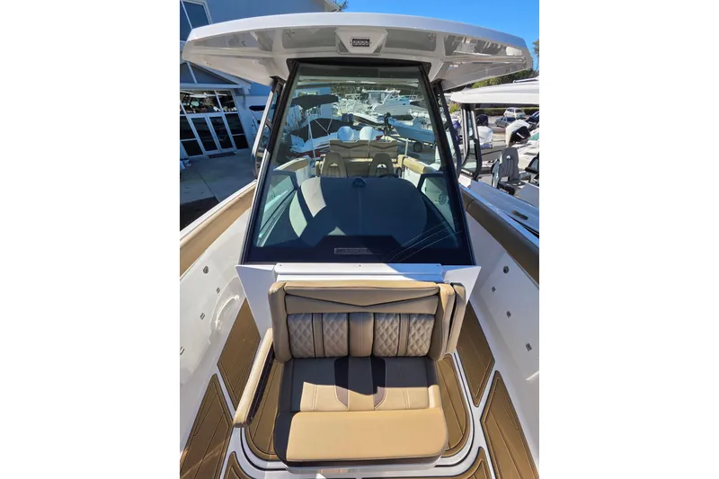 Slide: The Image of 2026 Monterey Elite 30 OB boat with luxurious seating and modern design. - 19