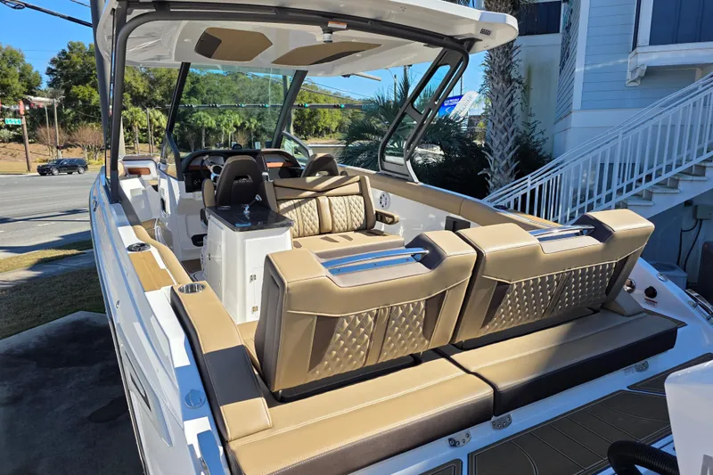 Slide: The Image of 2026 Monterey Elite 30 OB boat with luxurious seating and modern design. - 6