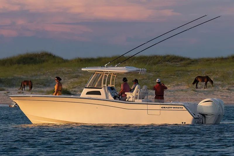 The Image of Manufacturer Provided Image: 2024 Grady-White Canyon 306 boat on water with people fishing, horses on shore. - 0