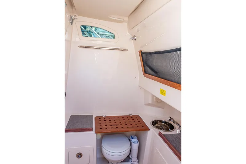 Slide: The Image of Manufacturer Provided Image: 2024 Grady-White Canyon 306 boat interior with toilet and sink - 7