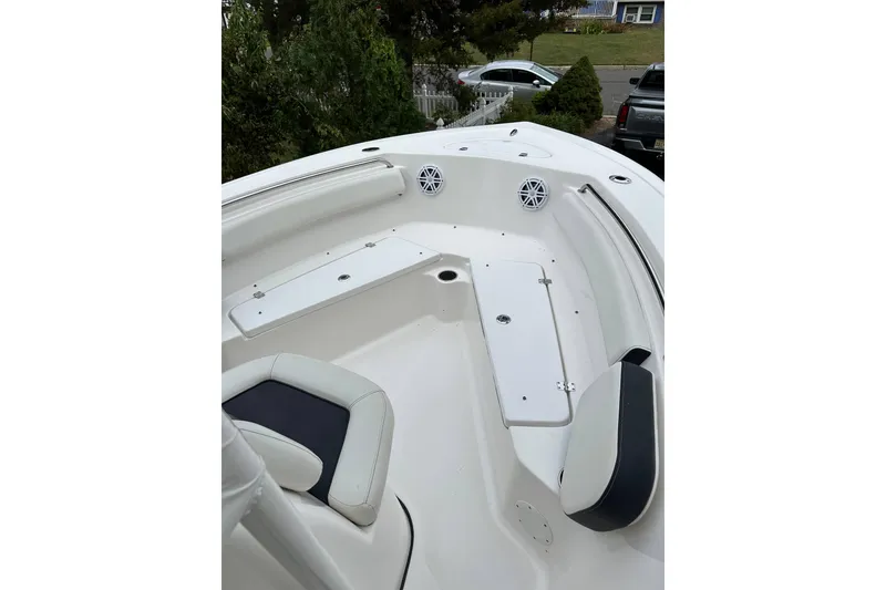 Slide: The Image of 2022 Tidewater 210 CC Adventure boat interior with seating and storage compartments. - 8